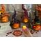 Here are four Halloween witches. They are made from dried gourds. Each has a witch hat and comes with a candle to light their carved faces.